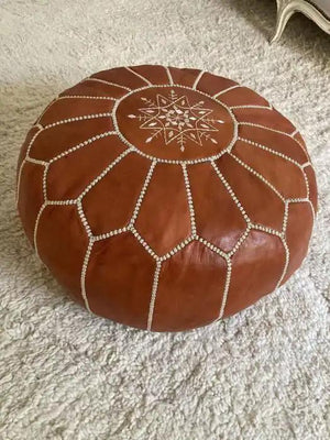 Traditional brown Moroccan leather pouf front view