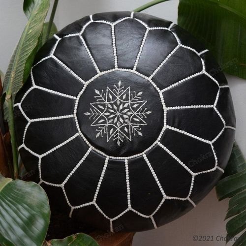 Black Moroccan leather pouf with white stitched detailing