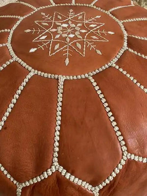 Traditional brown Moroccan leather pouf detail view