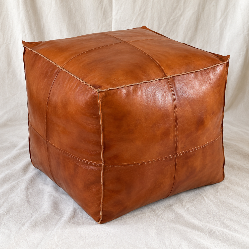 Handmade Moroccan Goatskin Leather Square Ottoman Pouf – Brown – three-quarter view with stitched leather panels