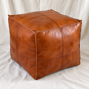 Handmade Moroccan Goatskin Leather Square Ottoman Pouf – Brown – three-quarter view with stitched leather panels