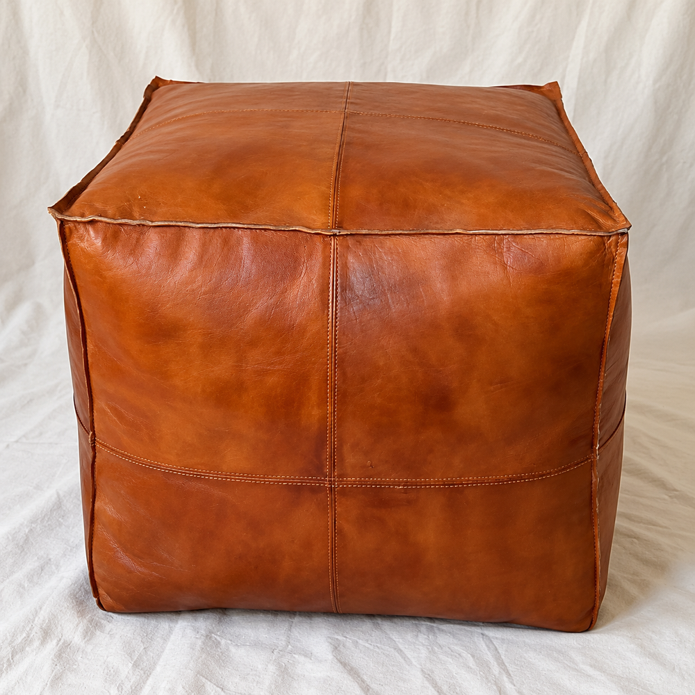 Handmade Moroccan Goatskin Leather Square Ottoman Pouf – Brown – three-quarter view with stitched leather panels